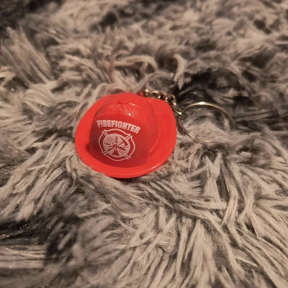 Red and white fireman’s hat keychain with light